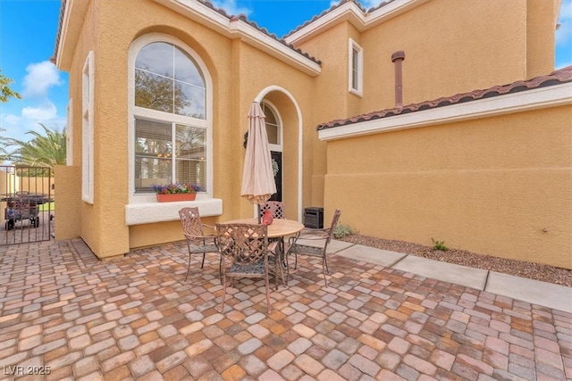 view of patio featuring outdoor dining area