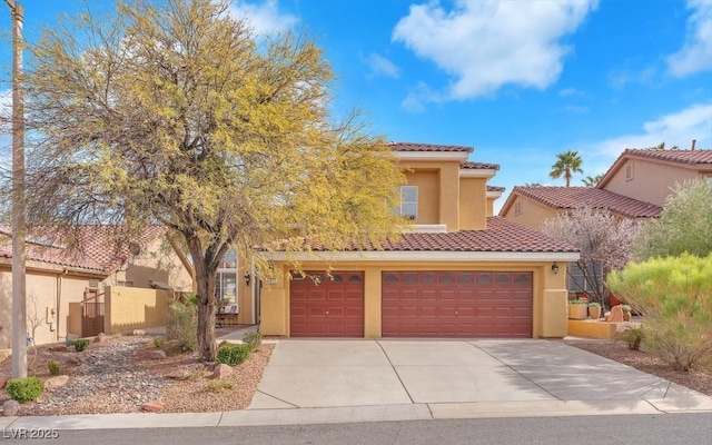 view of front of house with a tile roof, fence, concrete driveway, and stucco siding