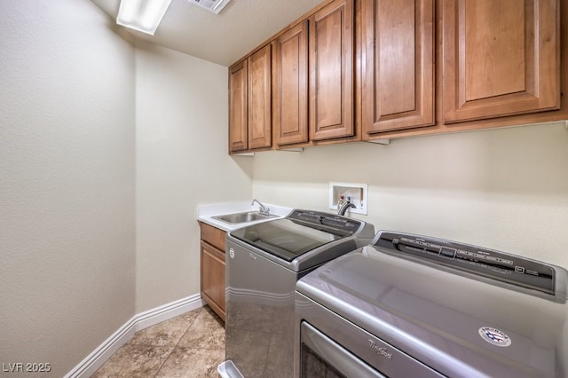 1332 Cedar Berry Ct, Henderson, NV 89012 - laundry area with baseboards, washer and clothes dryer, cabinet space, and light tile patterned floors