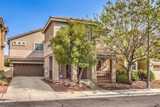 1332 Cedar Berry Ct, Henderson, NV 89012 - view of front of home featuring an attached garage, stucco siding, concrete driveway, a porch, and a tiled roof