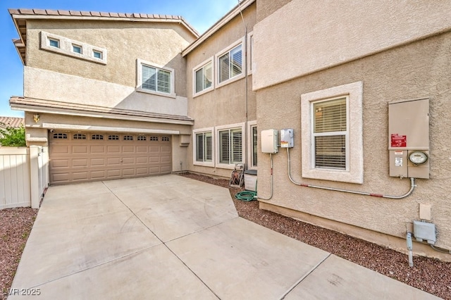 1332 Cedar Berry Ct, Henderson, NV 89012 - view of front of house featuring stucco siding, a garage, and driveway
