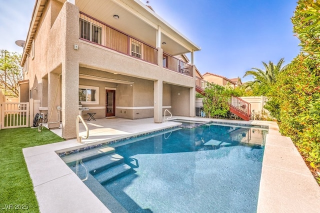 1332 Cedar Berry Ct, Henderson, NV 89012 - back of house with a patio, stucco siding, a balcony, and stairway