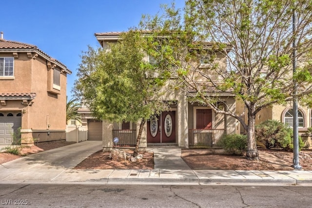 1332 Cedar Berry Ct, Henderson, NV 89012 - view of front facade featuring stucco siding, a tiled roof, a garage, and driveway