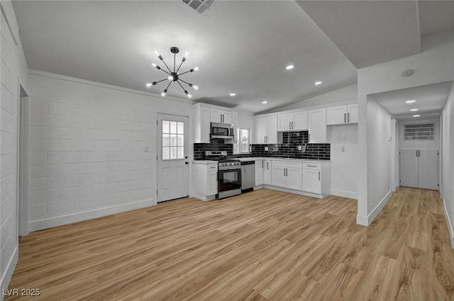 kitchen with white cabinetry, light wood-style flooring, visible vents, and appliances with stainless steel finishes