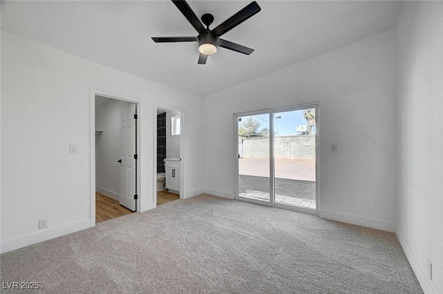 unfurnished bedroom featuring access to outside, baseboards, connected bathroom, and light colored carpet