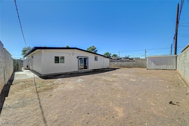 exterior space with a fenced backyard