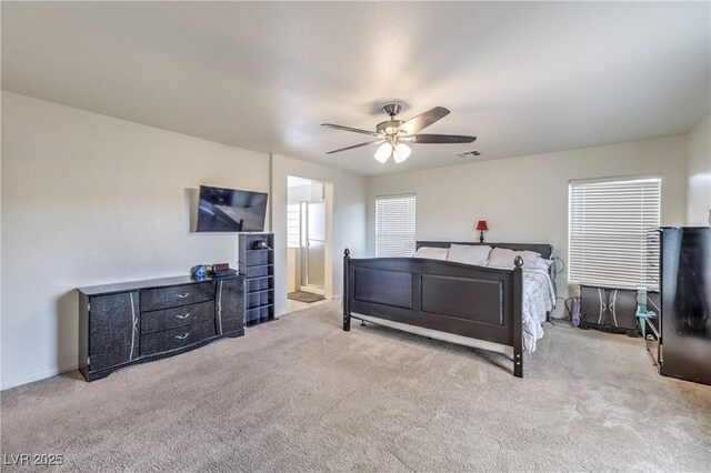 bedroom featuring carpet flooring, ceiling fan, visible vents, and baseboards