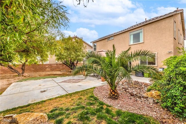 view of yard with a patio and fence