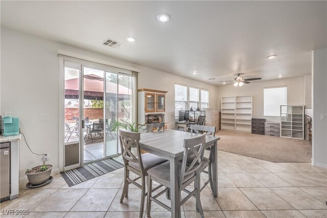 dining space featuring baseboards, visible vents, a ceiling fan, light tile patterned flooring, and recessed lighting