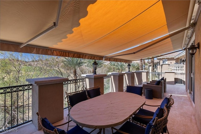 view of patio / terrace featuring outdoor dining space and a balcony