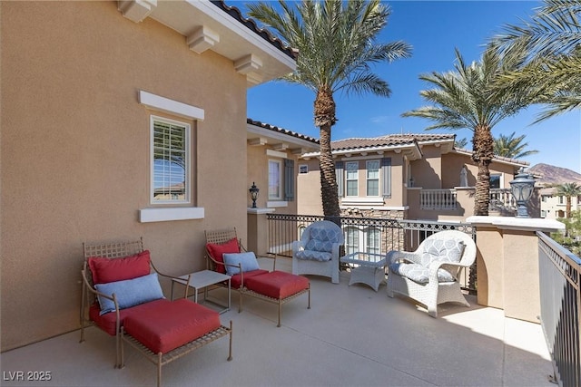 view of patio / terrace with a balcony