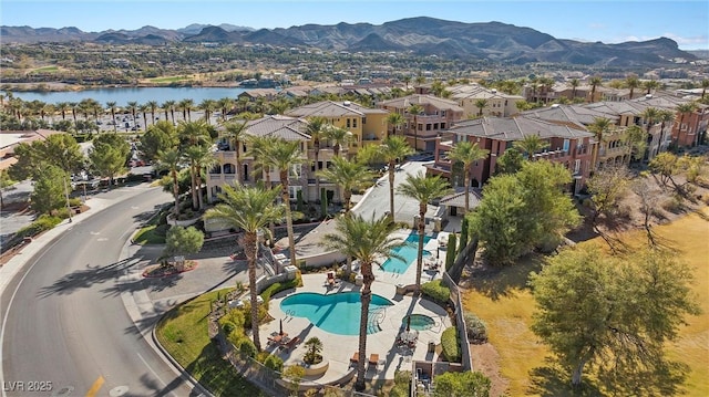 bird's eye view featuring a residential view and a water and mountain view