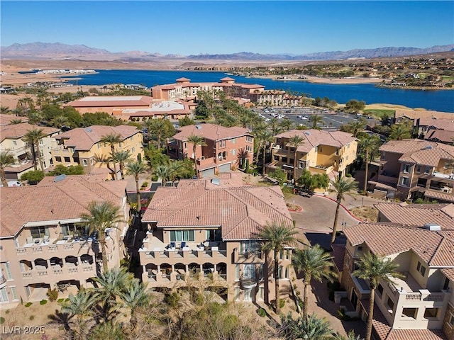 bird's eye view with a residential view and a water and mountain view