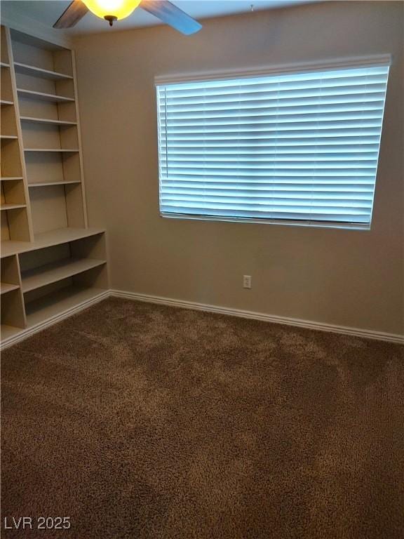 unfurnished bedroom with ceiling fan, baseboards, and carpet flooring
