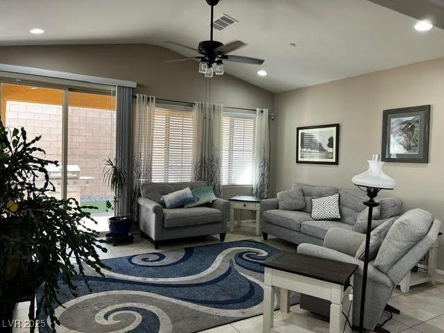 living room featuring a ceiling fan, recessed lighting, visible vents, and vaulted ceiling