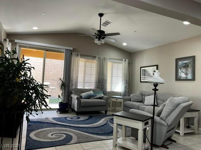 tiled living room featuring vaulted ceiling, ceiling fan, visible vents, and recessed lighting