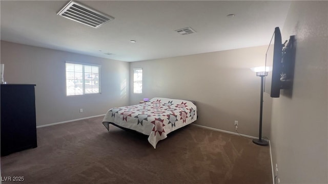 bedroom with carpet flooring, visible vents, and baseboards