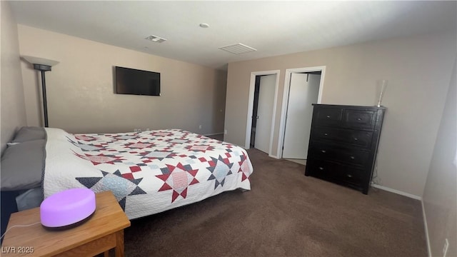 carpeted bedroom featuring baseboards and visible vents