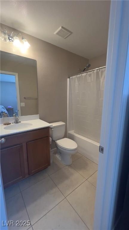 full bathroom with visible vents, shower / bathtub combination with curtain, toilet, vanity, and tile patterned flooring