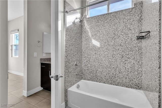 full bathroom with bathing tub / shower combination, vanity, baseboards, and tile patterned floors