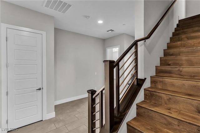 staircase with baseboards, visible vents, and recessed lighting