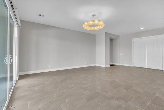 unfurnished bedroom with visible vents and baseboards