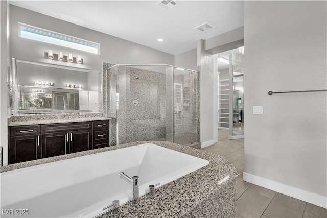 bathroom featuring tile patterned flooring, visible vents, a bath, and a shower stall