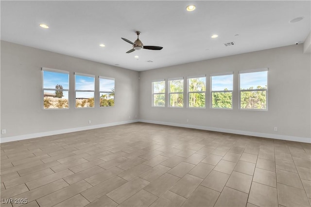 unfurnished room featuring visible vents, recessed lighting, a ceiling fan, and baseboards