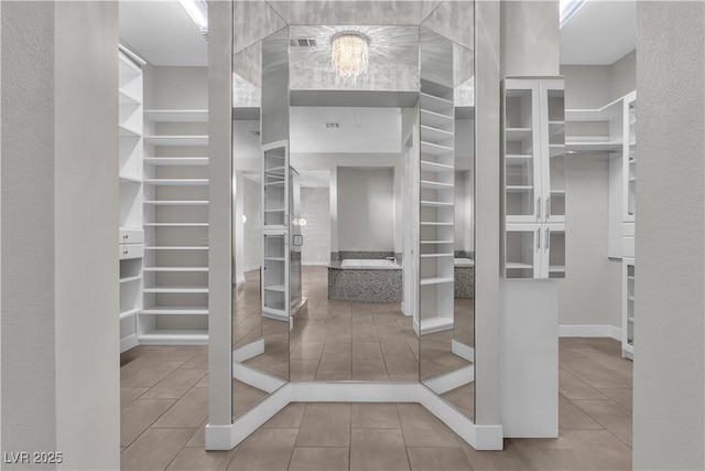 spacious closet with visible vents and tile patterned floors