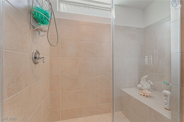 full bath featuring tiled shower