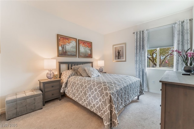 bedroom featuring carpet and baseboards