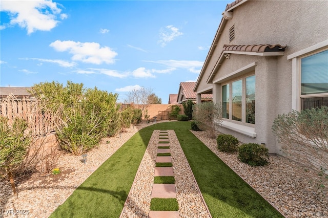 view of yard with a fenced backyard