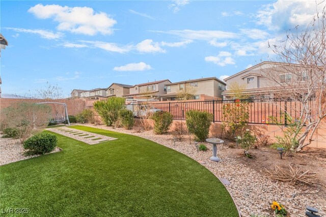 view of yard featuring a residential view and fence