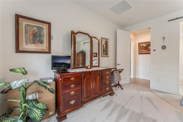 interior space with baseboards and visible vents