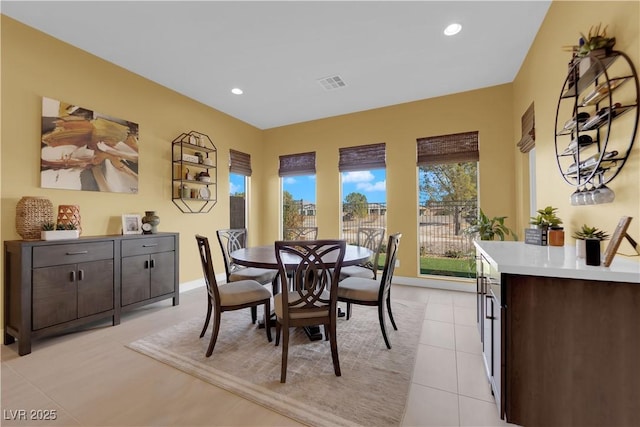 dining space with recessed lighting, visible vents, and light tile patterned flooring