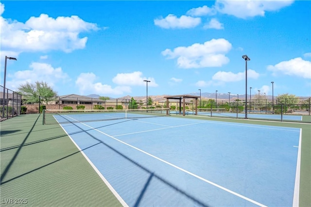 view of sport court with fence