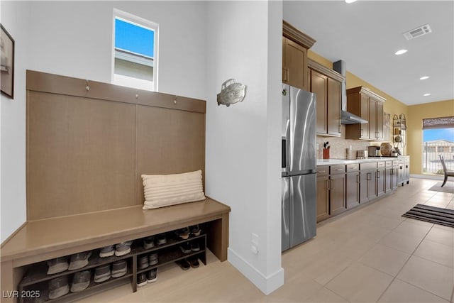 mudroom featuring recessed lighting, visible vents, baseboards, and light tile patterned flooring