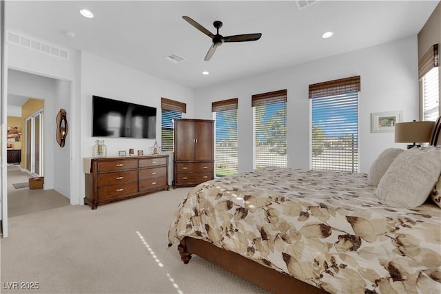 bedroom featuring recessed lighting, visible vents, and light carpet