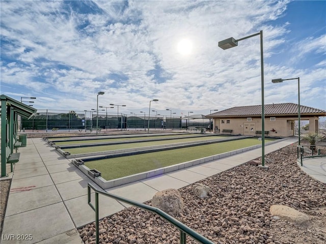 view of community with fence