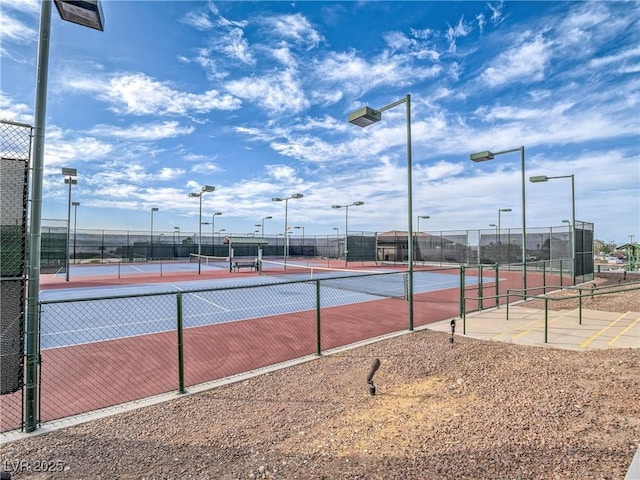 view of tennis court with fence