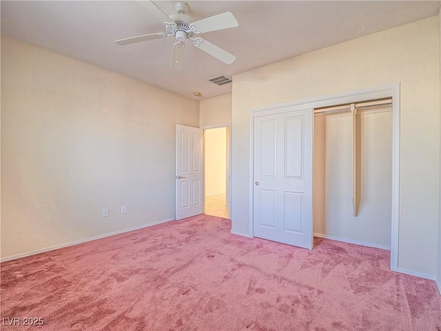 unfurnished bedroom featuring carpet floors, a closet, visible vents, and baseboards