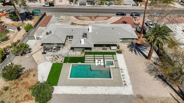 view from above of property featuring a pool area
