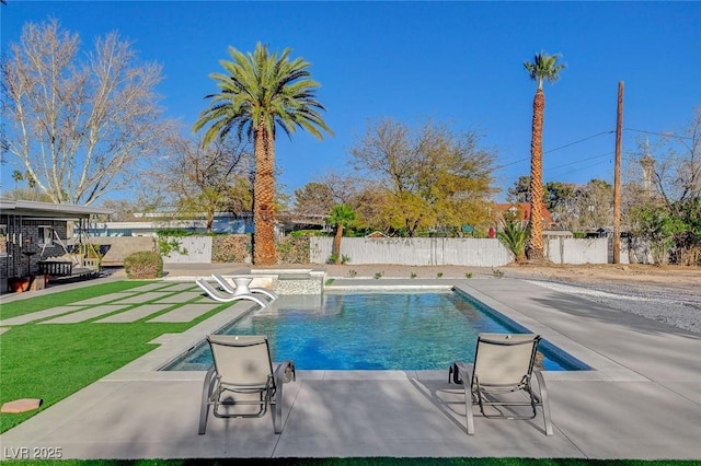 view of swimming pool featuring a fenced backyard and a patio area