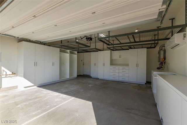 garage with a garage door opener and a wall unit AC