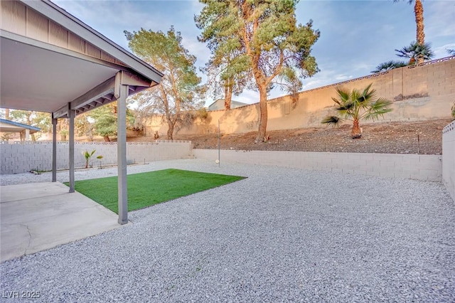 view of yard with a patio area and a fenced backyard