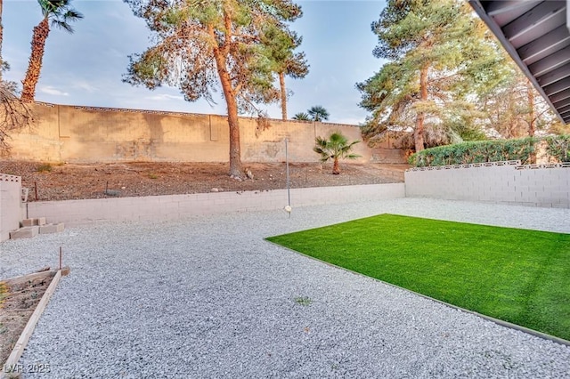 view of yard with a fenced backyard