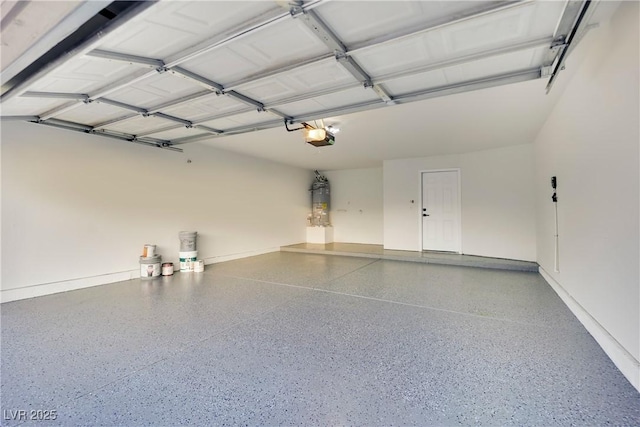 garage with baseboards and a garage door opener