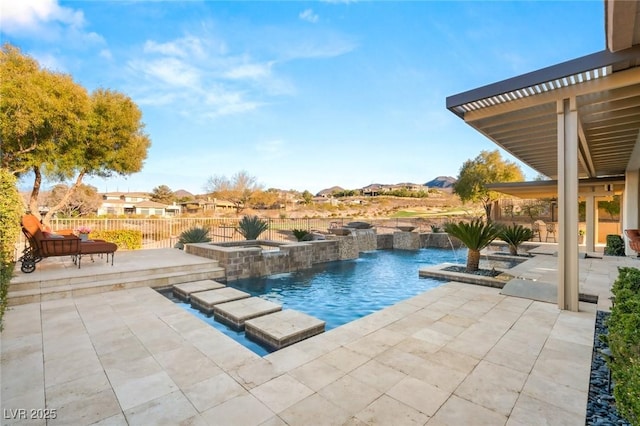 view of swimming pool with a fenced in pool, a patio, fence, and an in ground hot tub