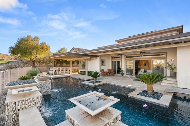 view of pool with a fenced in pool, outdoor dry bar, a patio area, fence, and an in ground hot tub