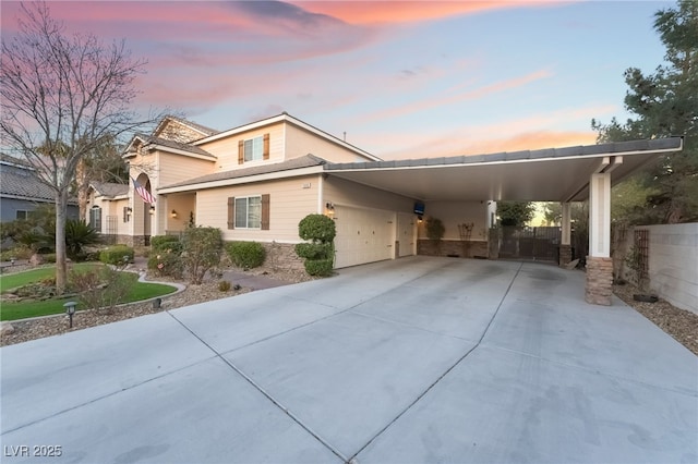 view of front of house with a carport, fence, and driveway